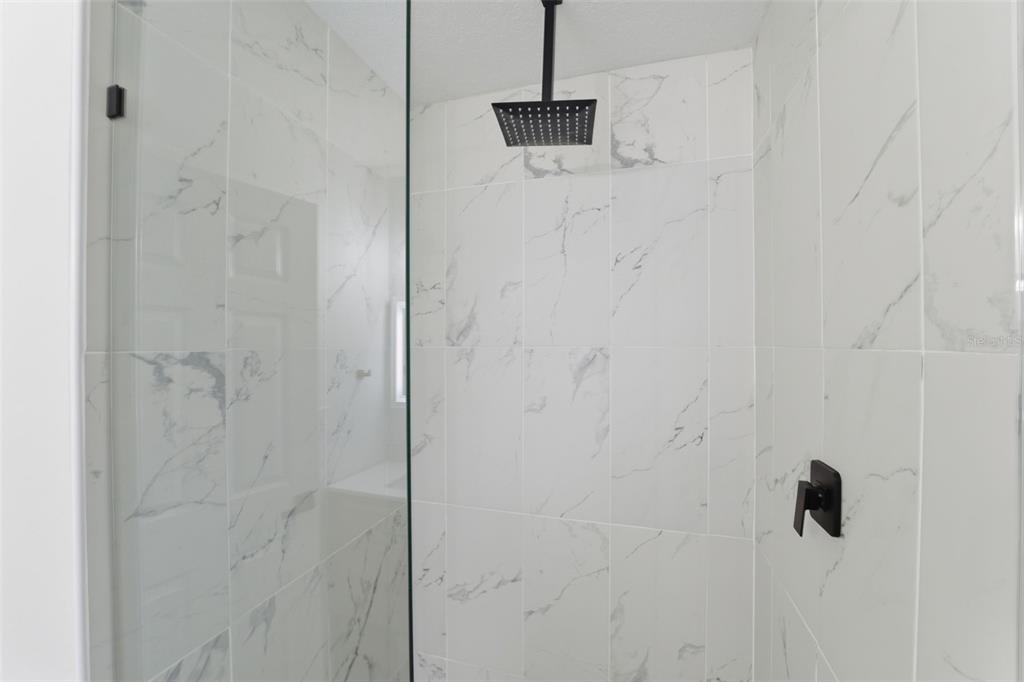 8025 San Fernando Drive Port Richey, FL 34668 - Photo 16 of 22 a bathroom with a shower