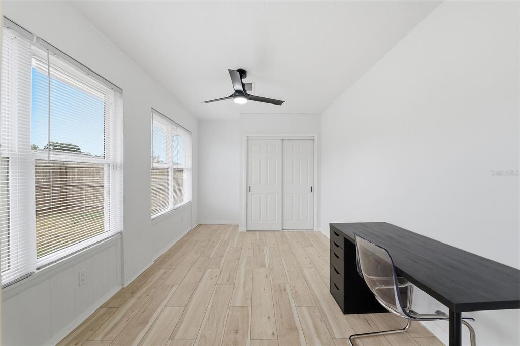 8025 San Fernando Drive Port Richey, FL 34668 - Photo 19 of 22 a view of a room with wooden floor and windows