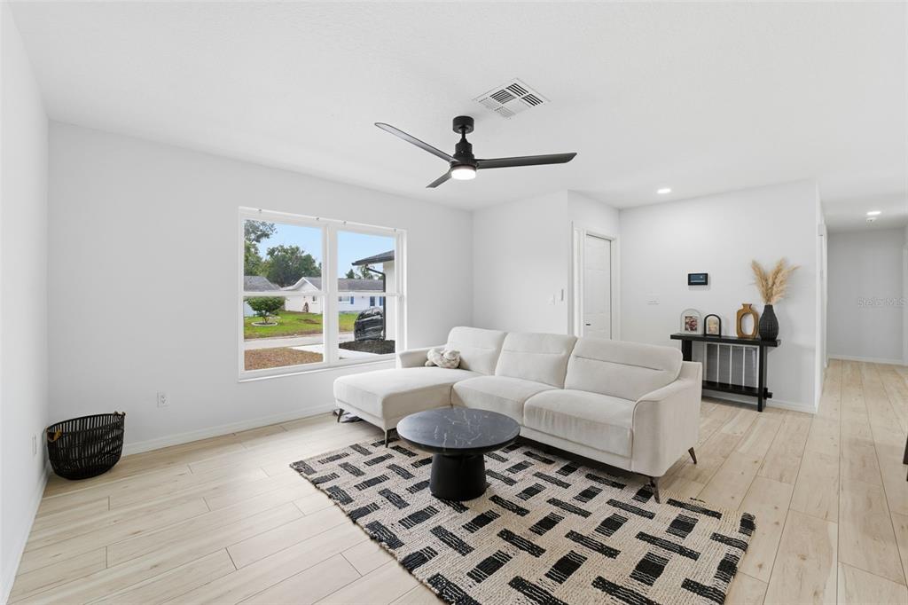 8025 San Fernando Drive Port Richey, FL 34668 - Photo 5 of 22 a living room with furniture and a rug