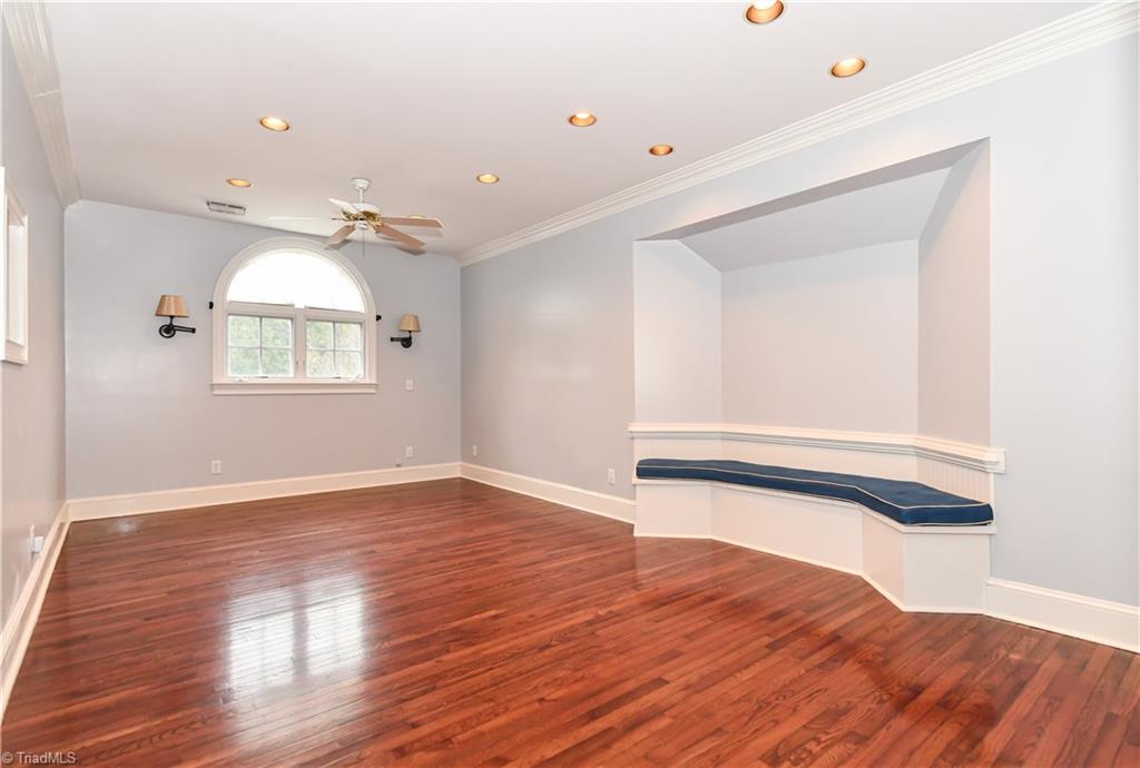 5606 Wallburg-High Point Road High Point, NC 27265 - Photo 13 of 30 The second level "other" room has hardwood flooring, recessed lighting, ceiling fan, CUSTOM built-in bench, TV niche, and double door closet.