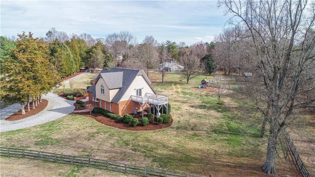 5606 Wallburg-High Point Road High Point, NC 27265 - Photo 21 of 30 This view displays the level yard that surrounds the home.