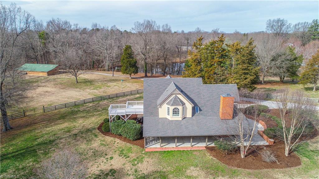 5606 Wallburg-High Point Road High Point, NC 27265 - Photo 22 of 30 This aerial view reveals the allurement of the fenced pasture and pond. There is beauty to be seen from every vantage point!!! *Note: cedar, magnolia, walnut, pecan, and persimmon trees throughout!