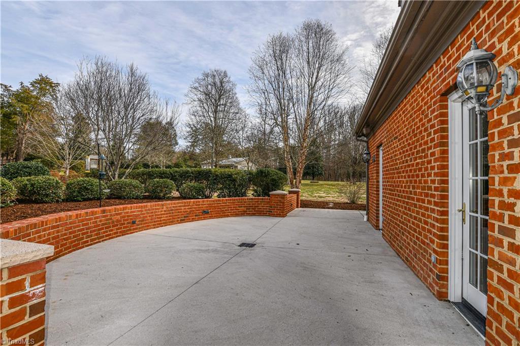 5606 Wallburg-High Point Road High Point, NC 27265 - Photo 25 of 30 This side of the wrap around patio has two French doors that lead into great room for wonderful flow! Add a table to this area and dine al fresco!