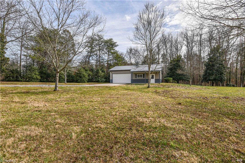 5606 Wallburg-High Point Road High Point, NC 27265 - Photo 26 of 30 The two-car detached garage is conveniently located just a short walk from the main residence. The garage includes many sought-after features, including a cupola with weathervane and large executive office.