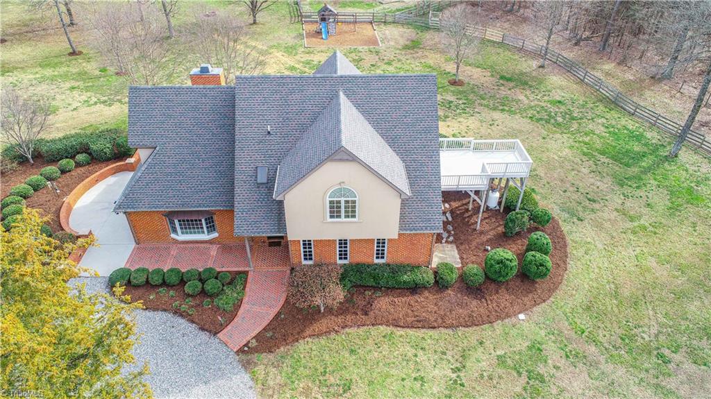 5606 Wallburg-High Point Road High Point, NC 27265 - Photo 4 of 30 This front elevation aerial offers a view of the multiple outdoor living spaces. Enjoy your morning coffee from the owner's deck (FRESH stain applied 2020) or an afternoon siesta on the patio.