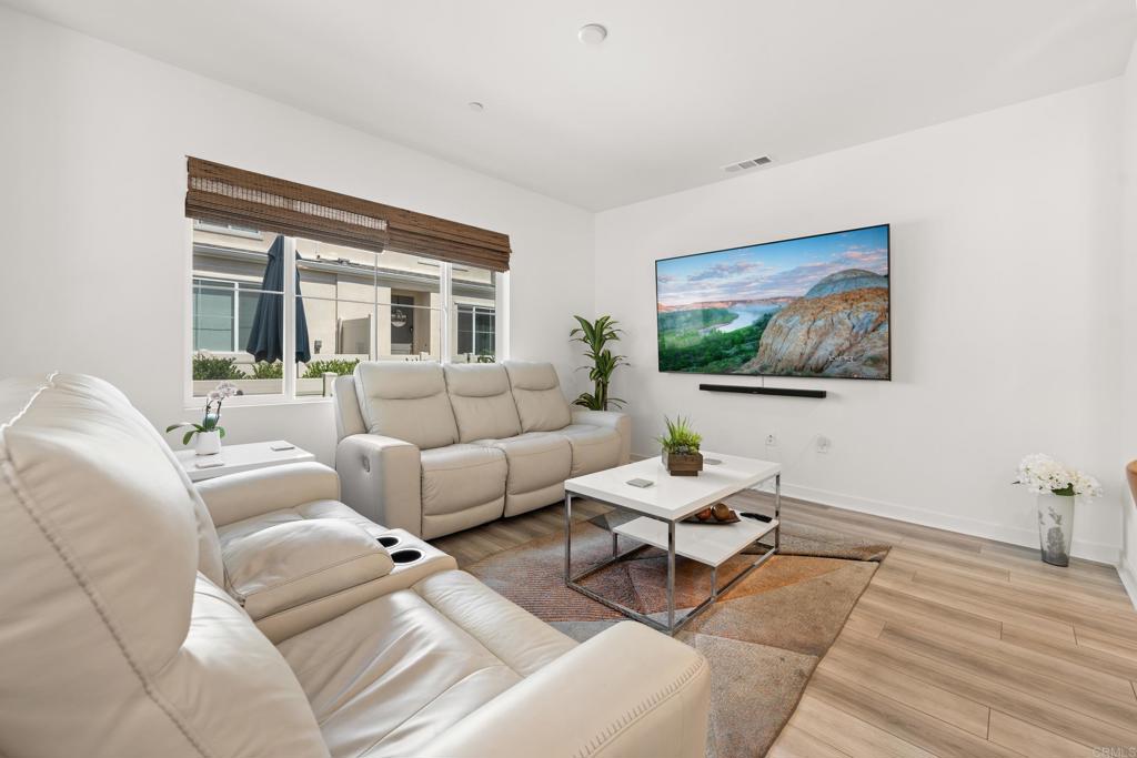 35115 Crop Place Fallbrook, CA 92028 - Photo 15 of 41 a living room with furniture and a flat screen tv