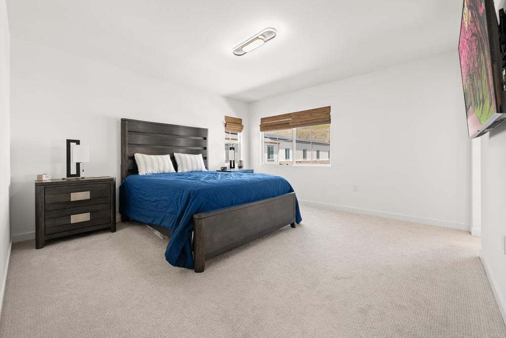 35115 Crop Place Fallbrook, CA 92028 - Photo 19 of 41 a bedroom with a bed and a night stand