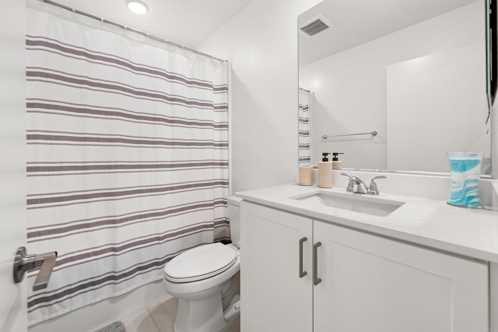 35115 Crop Place Fallbrook, CA 92028 - Photo 32 of 41 a bathroom with a sink a toilet and mirror