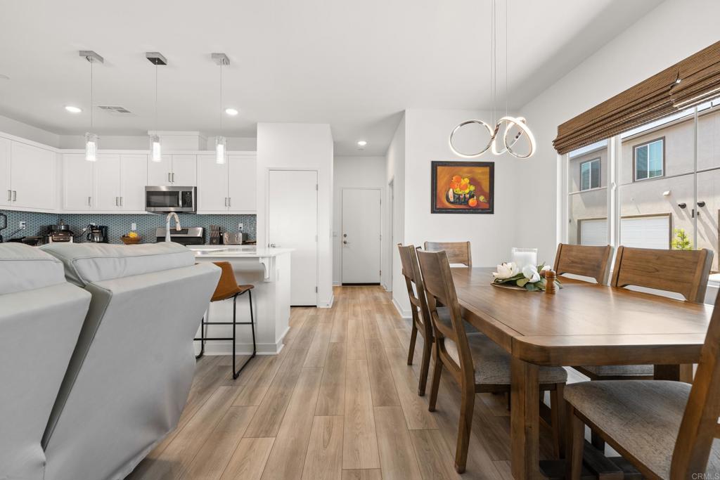 35115 Crop Place Fallbrook, CA 92028 - Photo 4 of 41 a view of a dining room with furniture and wooden floor