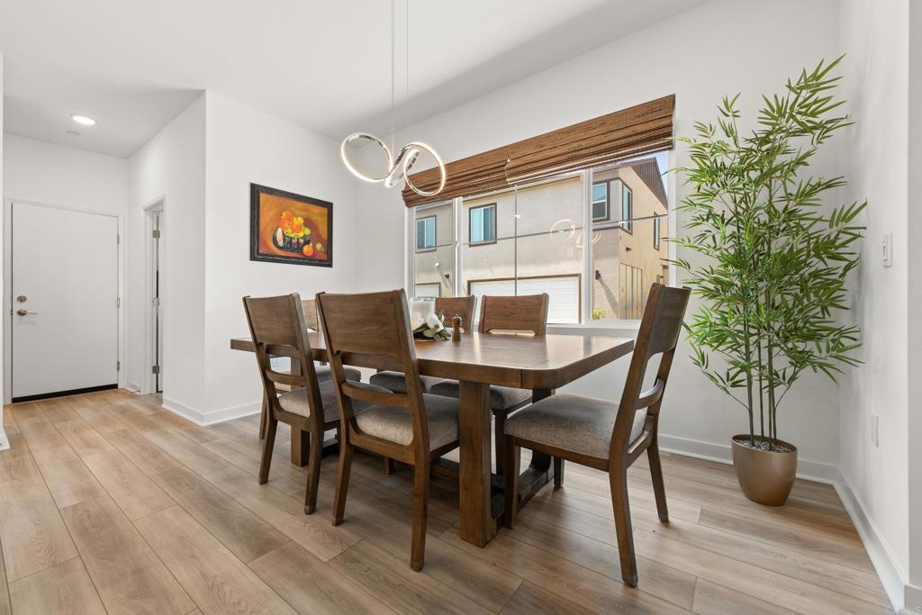 35115 Crop Place Fallbrook, CA 92028 - Photo 5 of 41 a view of a dining room with furniture and wooden floor