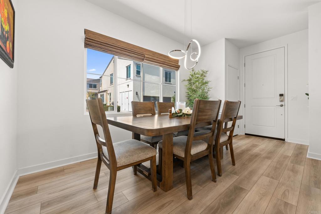 35115 Crop Place Fallbrook, CA 92028 - Photo 6 of 41 a view of a dining room with furniture and wooden floor