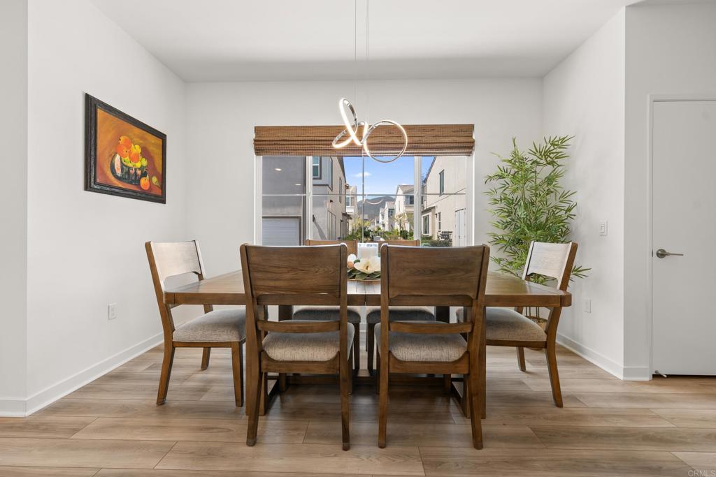 35115 Crop Place Fallbrook, CA 92028 - Photo 7 of 41 a view of a dining room with furniture and wooden floor