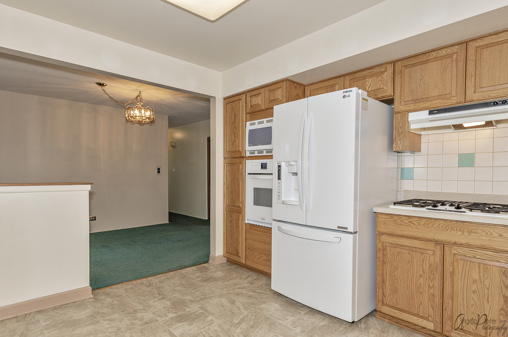 280 Westmere Road Des Plaines, IL 60016 - Photo 6 of 27 a white refrigerator freezer and a stove sitting inside of a kitchen