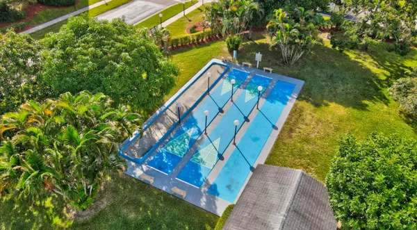 an aerial view of a house with a garden