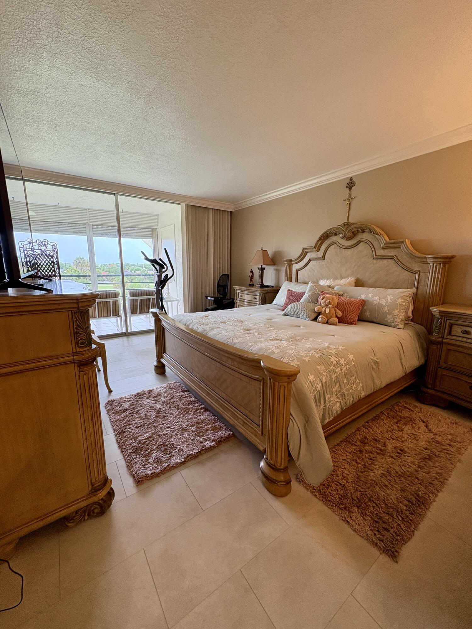 23249 Barwood Lane North, Unit 402 Boca Raton, FL 33428 - Photo 7 of 27 a bedroom with a bed and window