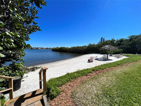 a view of a lake with a yard