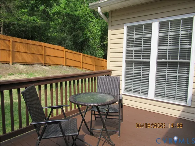 a view of a balcony with chairs