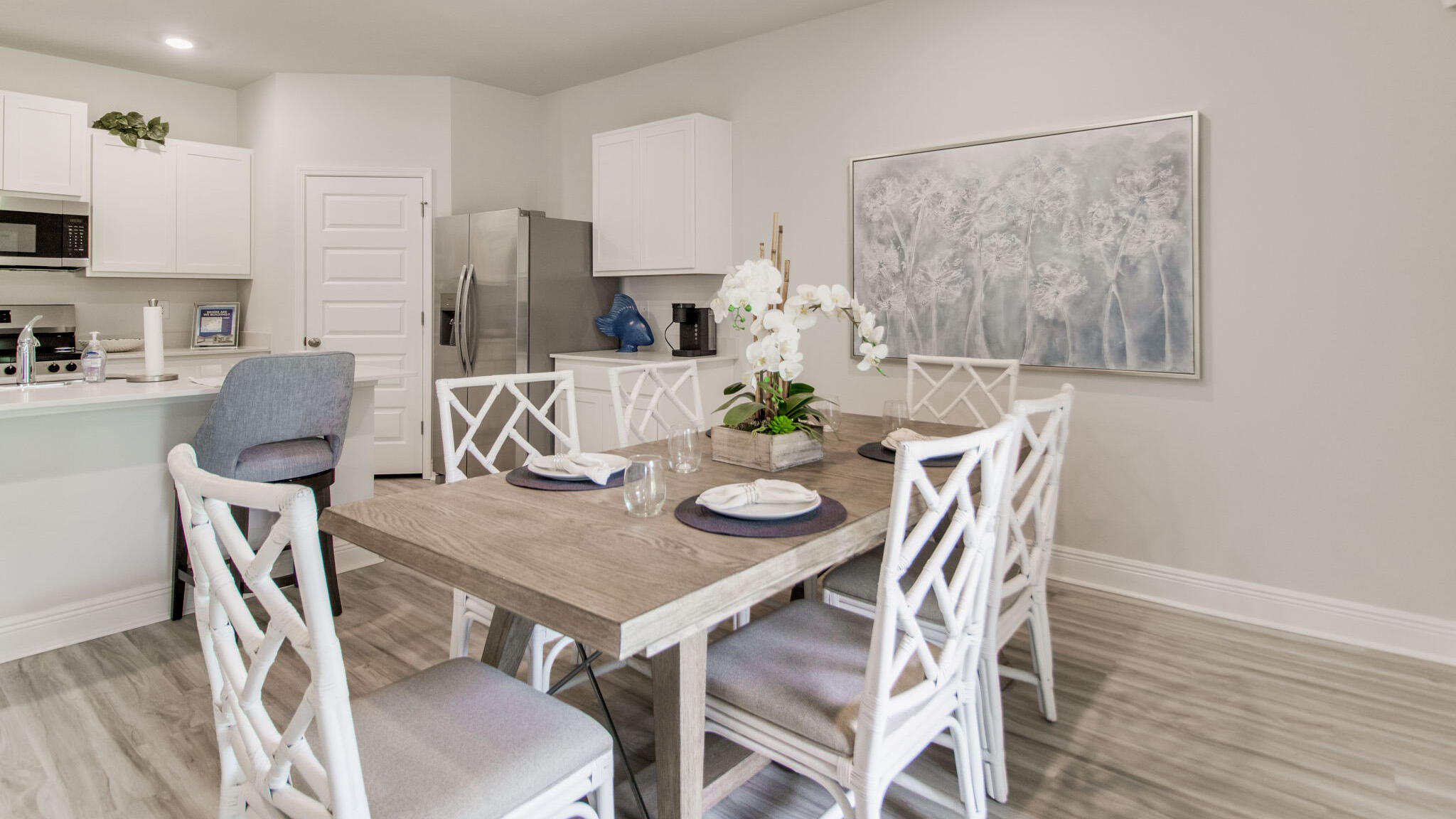 4698 Marine Loop Crestview, FL 32539 - Photo 8 of 37 a view of a dining room with furniture and wooden floor