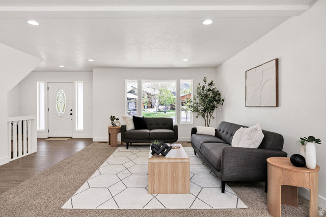 1552 Sumac Drive Logan, UT 84321 - Photo 5 of 72 Bright living area featuring recessed lighting, large picture windows, wood-finish flooring, and a white entry door with decorative glass
