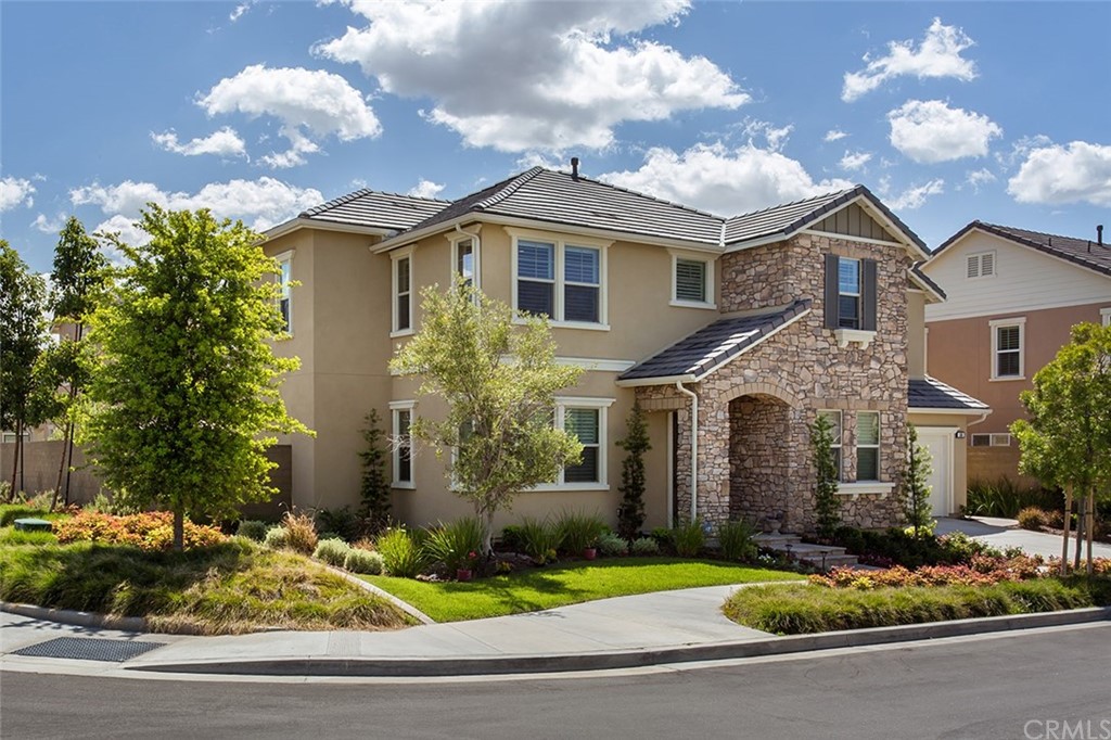 a front view of a house with yard