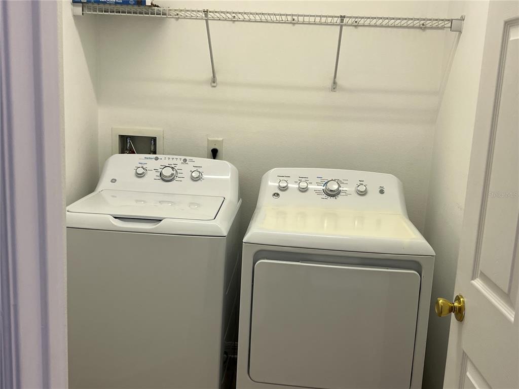 9013 Shepton Street Orlando, FL 32825 - Photo 12 of 20 a utility room with dryer and washer