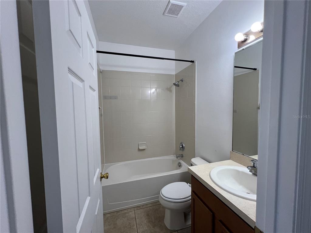 9013 Shepton Street Orlando, FL 32825 - Photo 13 of 20 a bathroom with a sink toilet and shower