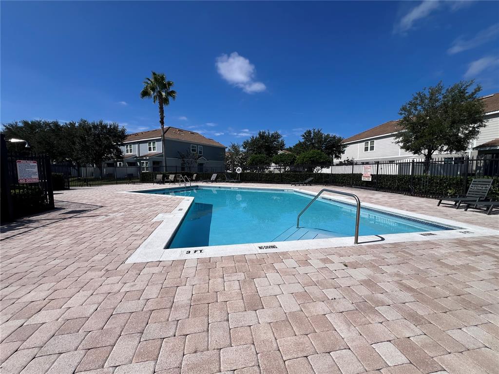 9013 Shepton Street Orlando, FL 32825 - Photo 19 of 20 a view of swimming pool with an outdoor space and seating area