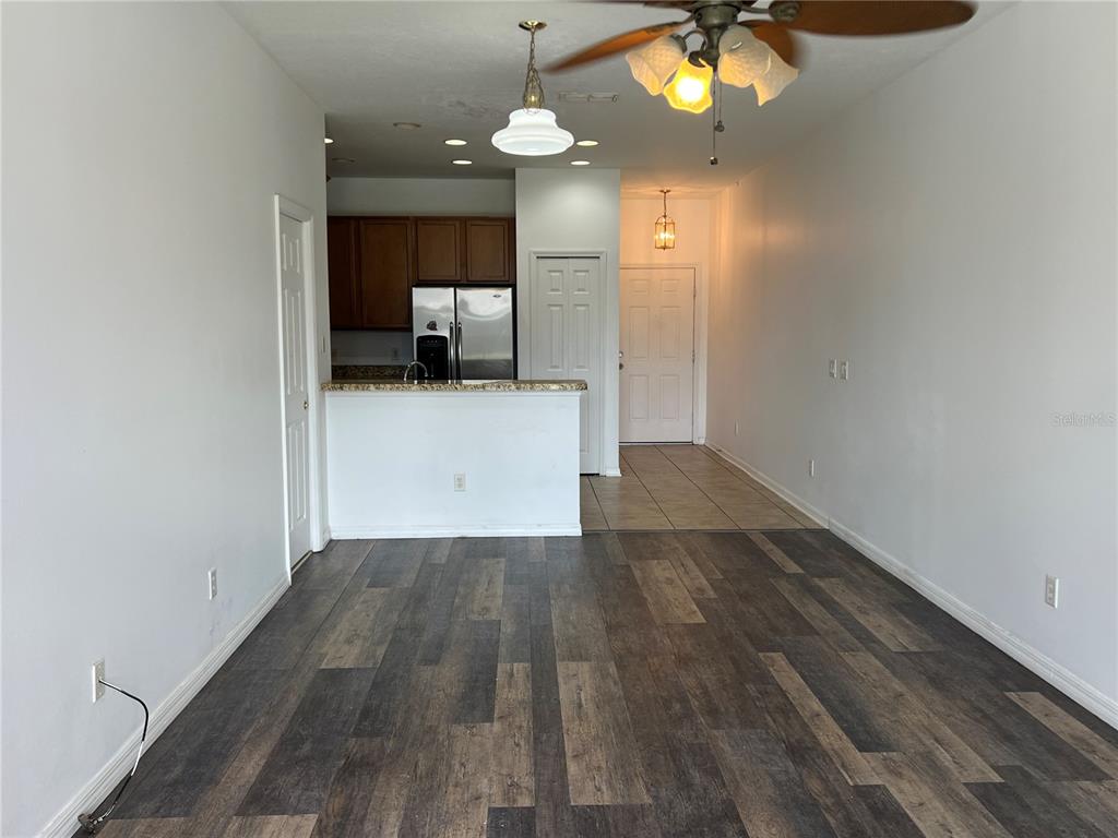 9013 Shepton Street Orlando, FL 32825 - Photo 3 of 20 wooden floor in an empty room with a mirror