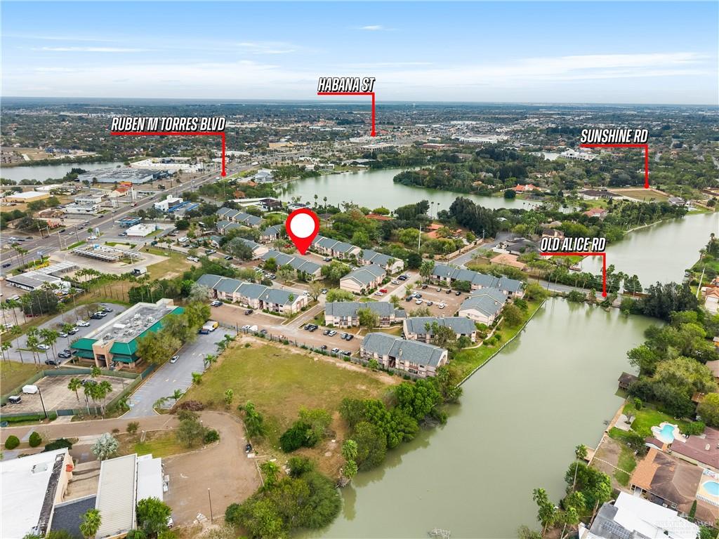 3005 Old Alice Road, Unit 200G Brownsville, TX 78521 - Photo 19 of 21 an aerial view of a houses with a lake view