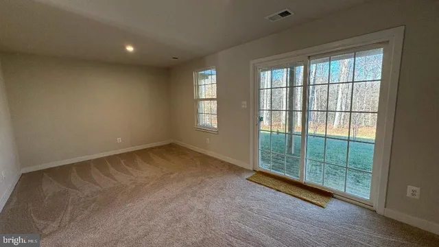 a view of balcony with wooden floor