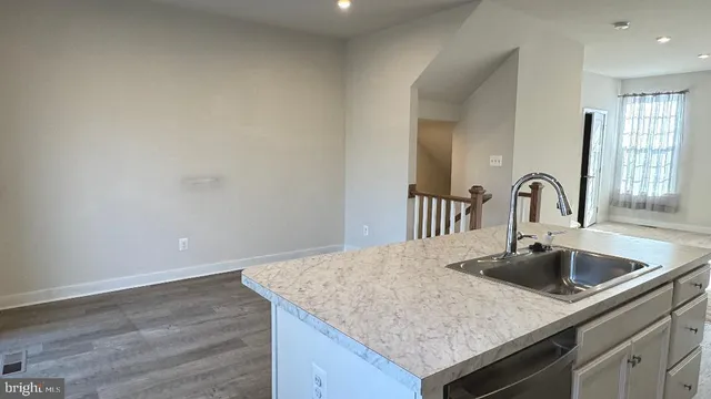 a view of a big room with windows and entryway