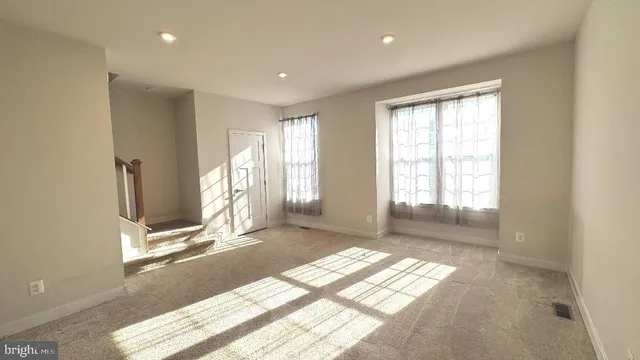 a view of empty room with windows