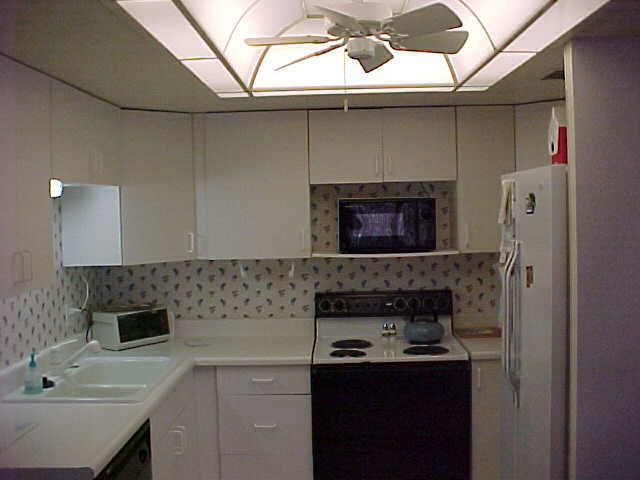 7940 East Camelback Road, Unit A104 Scottsdale, AZ 85251 - Photo 2 of 6 a kitchen with a sink and a refrigerator