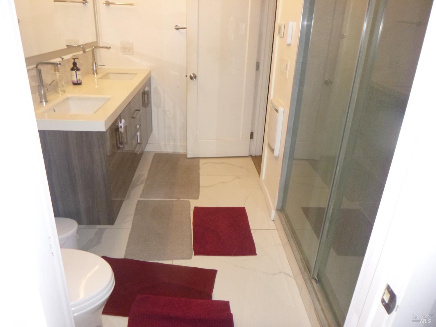 155 Canal Street, Unit 7 San Rafael, CA 94901 - Photo 2 of 17 a bathroom with a sink a toilet and shower