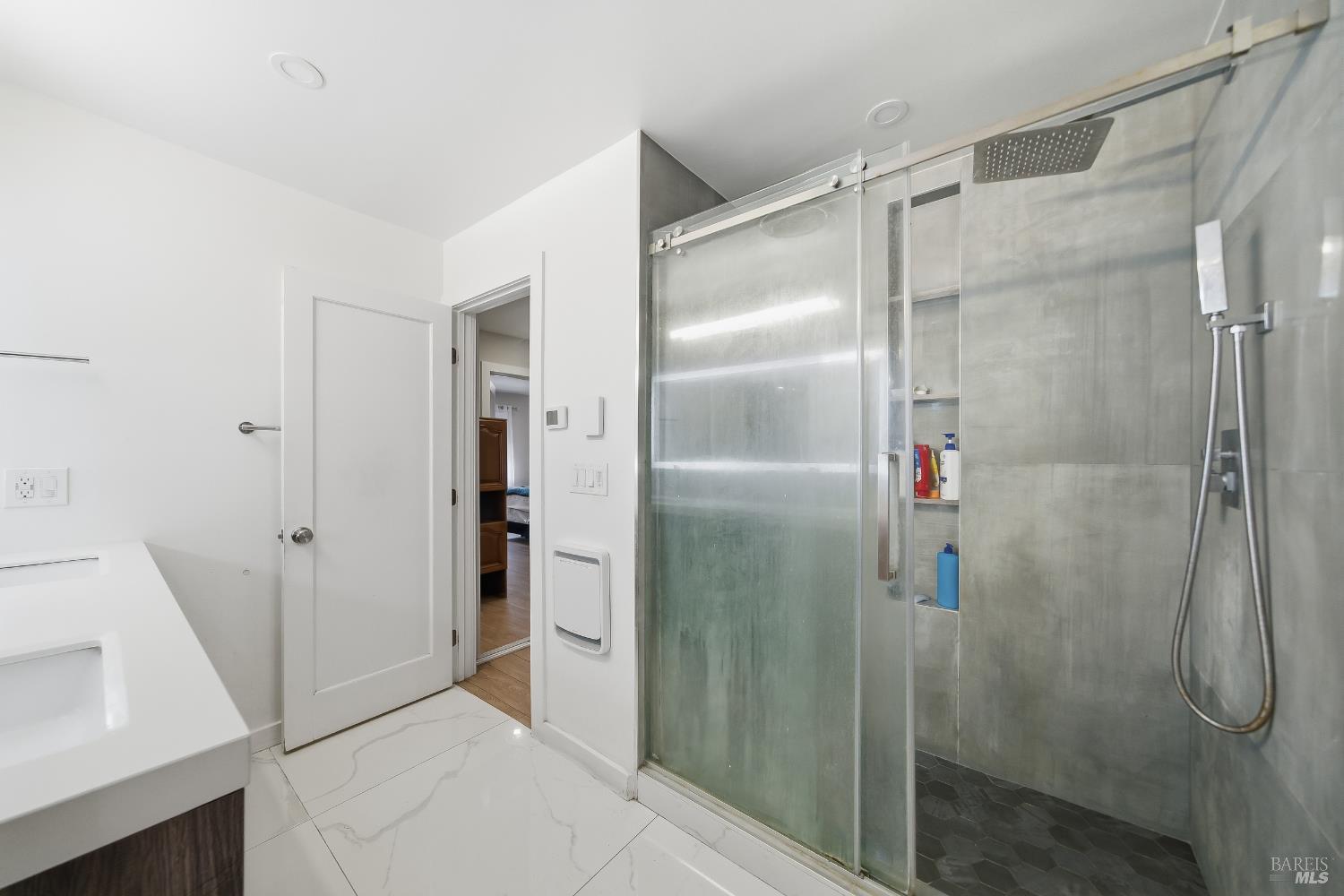 155 Canal Street, Unit 7 San Rafael, CA 94901 - Photo 7 of 17 a bathroom with a glass shower door