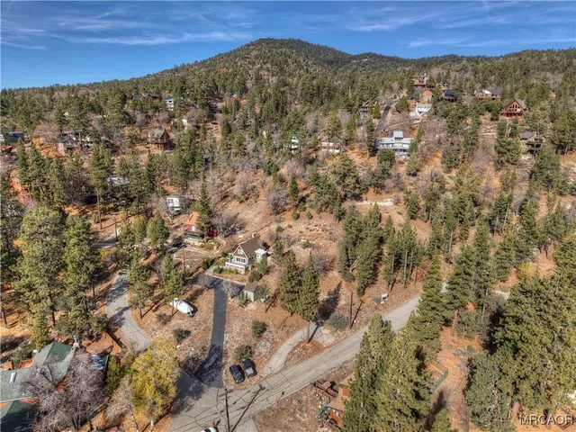 a view of a large building with a yard