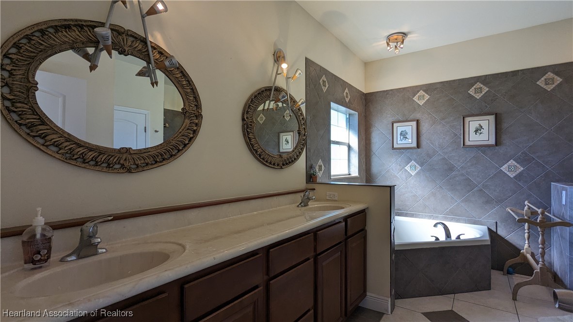 1101 Lakeside Way Sebring, FL 33876 - Photo 12 of 41 a bathroom with a sink and a mirror
