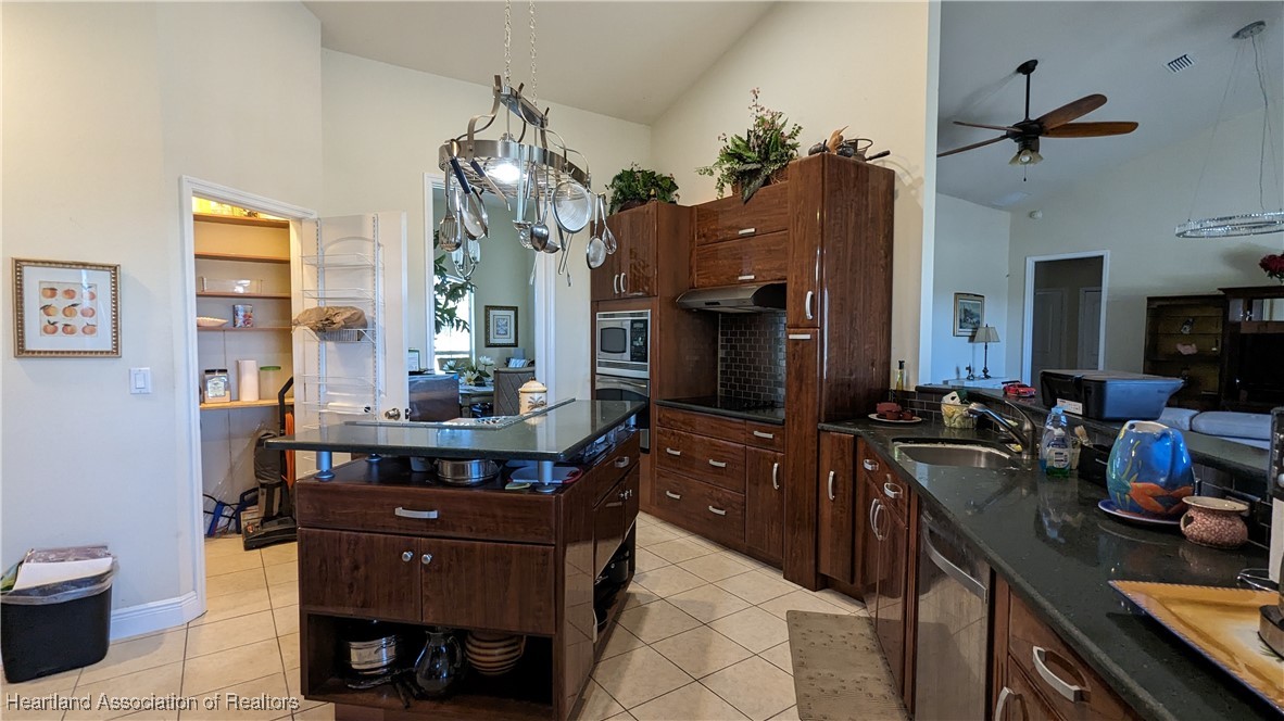 1101 Lakeside Way Sebring, FL 33876 - Photo 16 of 41 a kitchen with a table and chairs in it