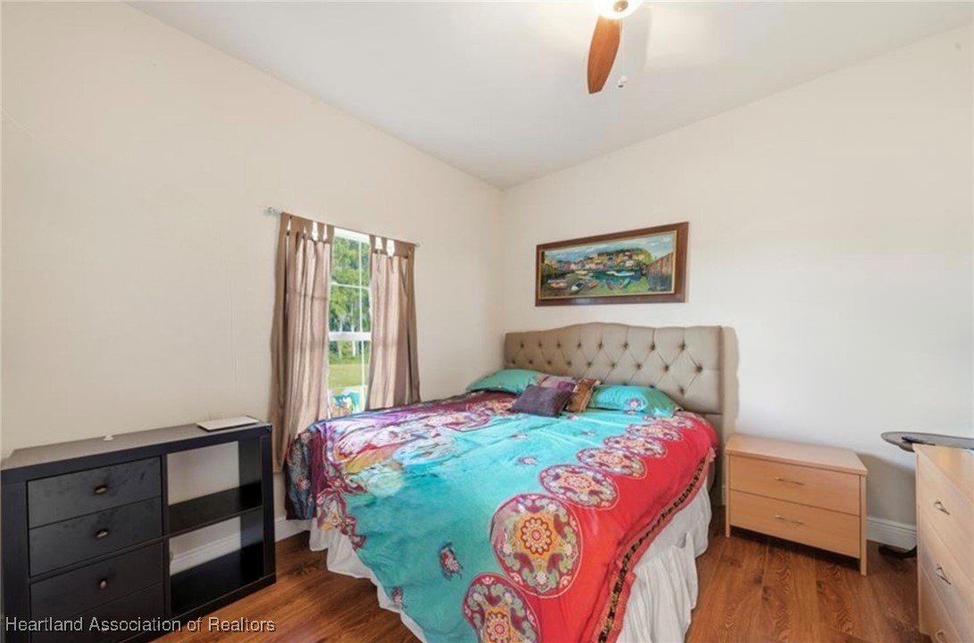 1101 Lakeside Way Sebring, FL 33876 - Photo 18 of 41 a bedroom with a bed and a window