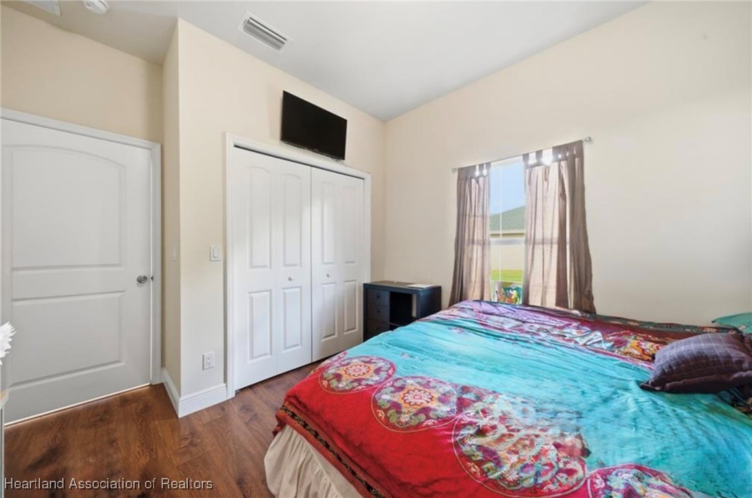 1101 Lakeside Way Sebring, FL 33876 - Photo 19 of 41 a bedroom with a bed and a window