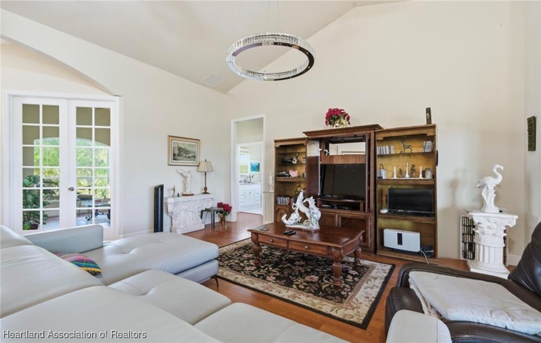1101 Lakeside Way Sebring, FL 33876 - Photo 20 of 41 a living room with furniture and a fireplace