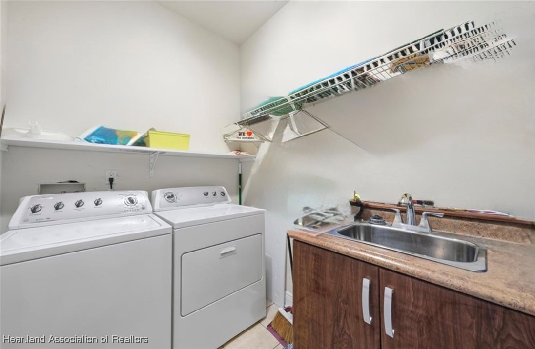 1101 Lakeside Way Sebring, FL 33876 - Photo 28 of 41 a utility room with dryer and washer