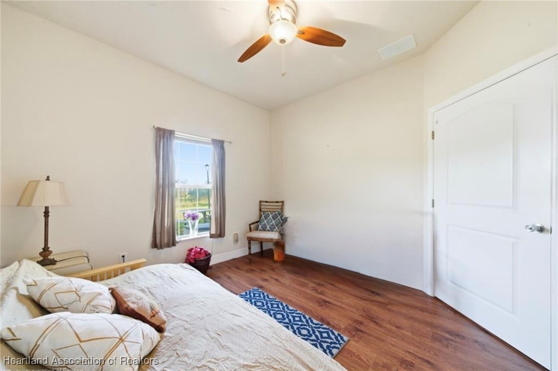 1101 Lakeside Way Sebring, FL 33876 - Photo 29 of 41 a bedroom with furniture and a window