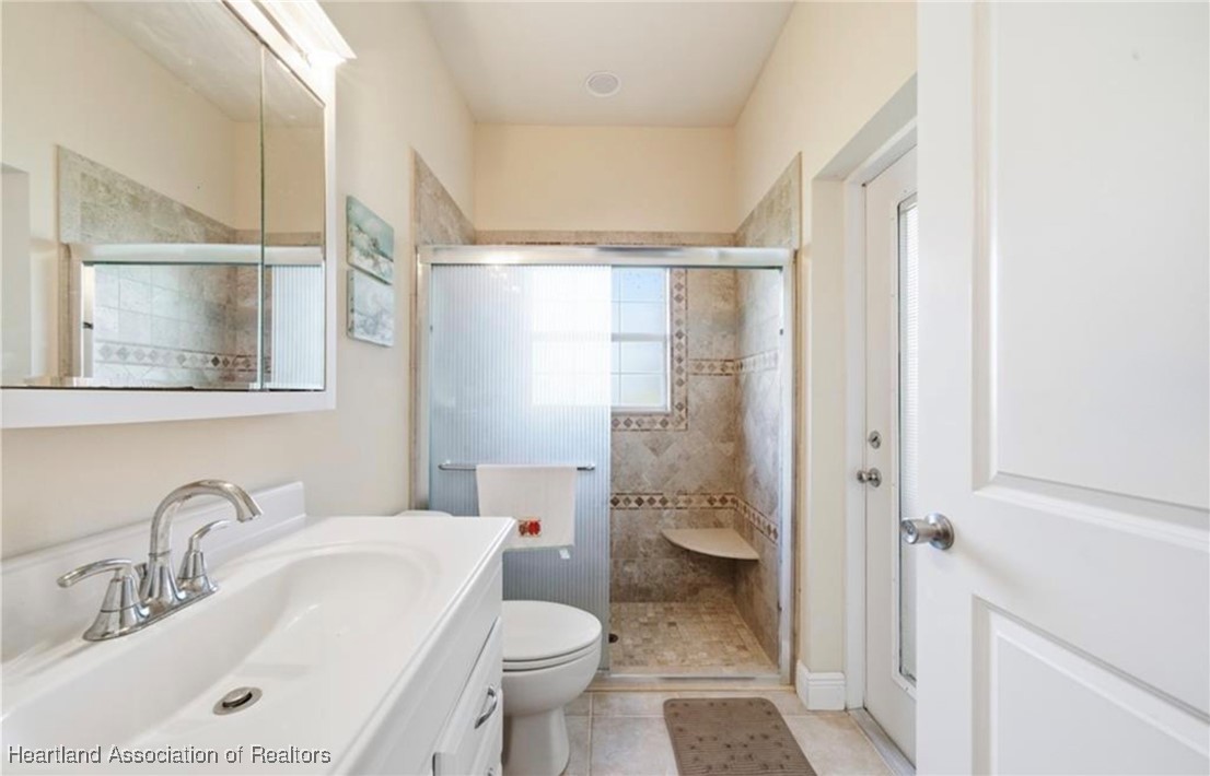 1101 Lakeside Way Sebring, FL 33876 - Photo 32 of 41 a bathroom with a sink toilet and shower