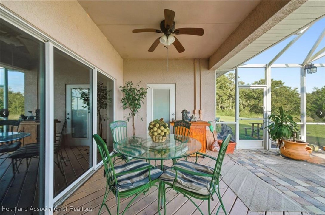 1101 Lakeside Way Sebring, FL 33876 - Photo 36 of 41 a outdoor space with patio the couches and a potted plant on a table