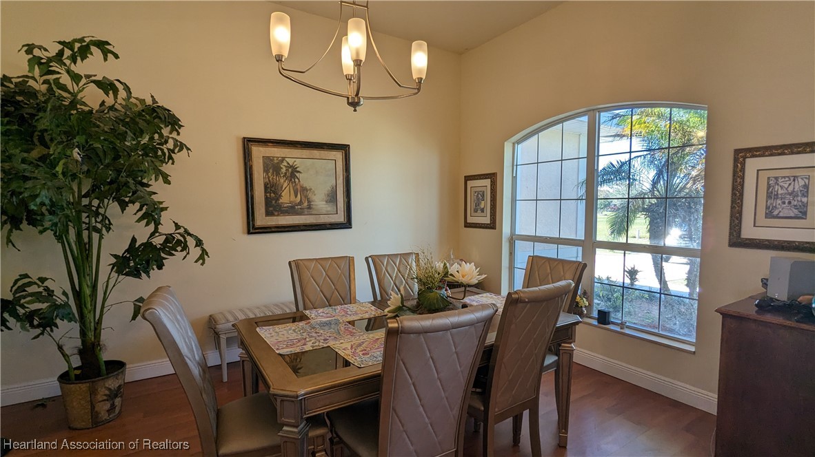 1101 Lakeside Way Sebring, FL 33876 - Photo 4 of 41 a view of a dining room with furniture window and wooden floor