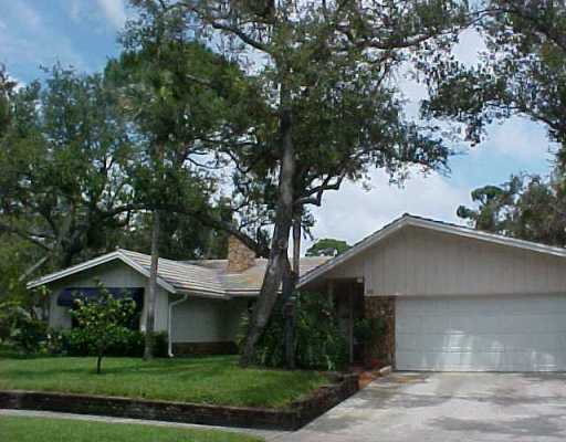 32 Southwest 14th Avenue Boca Raton, FL 33486 - Photo 1 of 11 a house with trees in the background