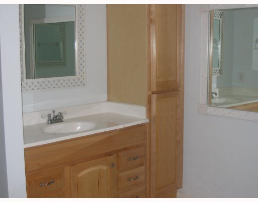 32 Southwest 14th Avenue Boca Raton, FL 33486 - Photo 7 of 11 a bathroom with a sink and a mirror