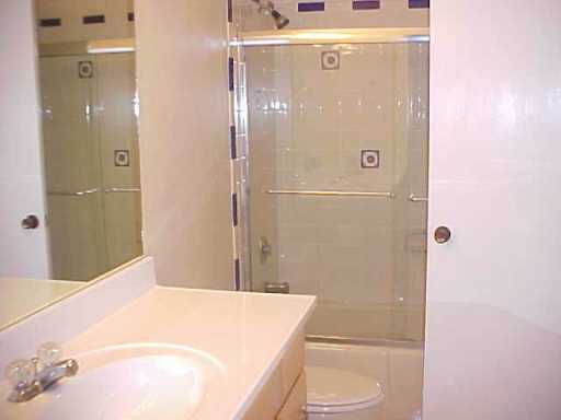 32 Southwest 14th Avenue Boca Raton, FL 33486 - Photo 8 of 11 a bathroom with a shower and a sink