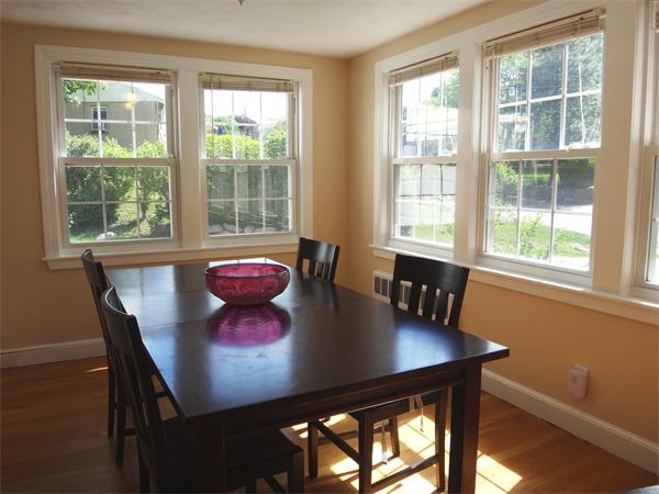56 Elder Road Needham, MA 02494 - Photo 3 of 10 a view of a dining room with furniture window and outside view
